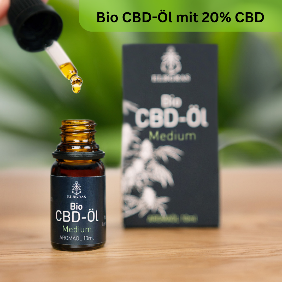 Braune Flasche Elbgras Bio-CBD-Öl 20% mit Pipette vor schwarzer Verpackung.